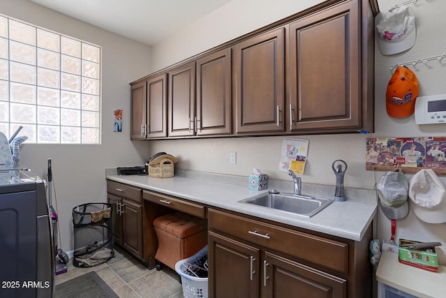 kitchen with sink and dark brown cabinets