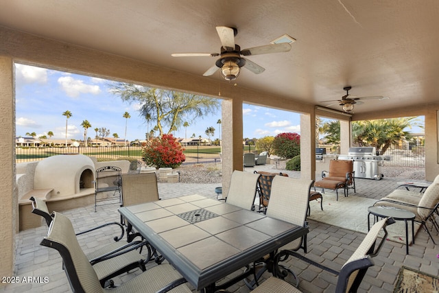 view of patio / terrace featuring area for grilling and ceiling fan