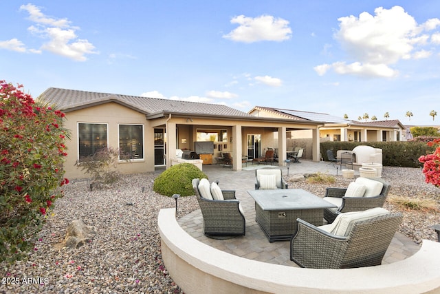 back of house with a patio