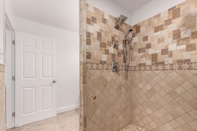 full bathroom with a tile shower