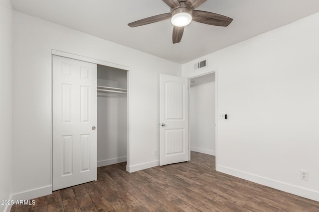 unfurnished bedroom with baseboards, visible vents, and wood finished floors