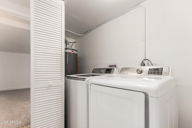 laundry room featuring water heater, laundry area, washer and clothes dryer, and carpet