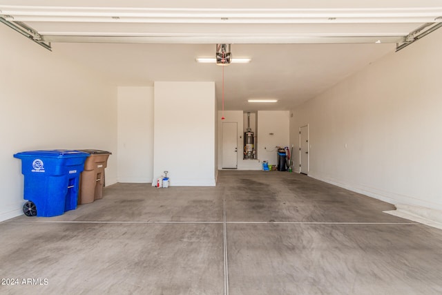 garage featuring water heater and a garage door opener