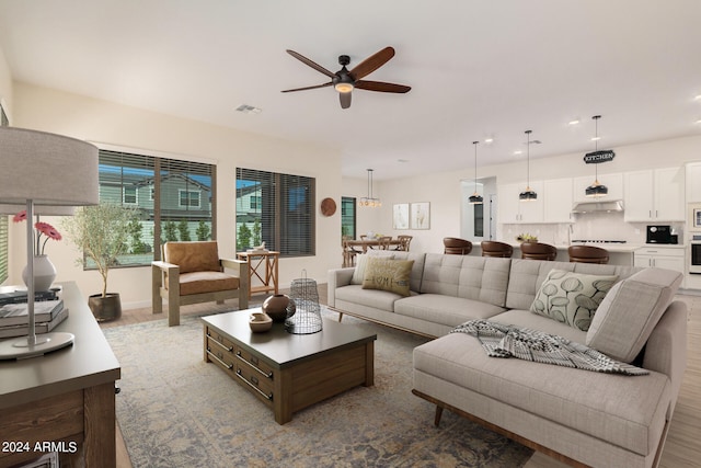 living room featuring ceiling fan