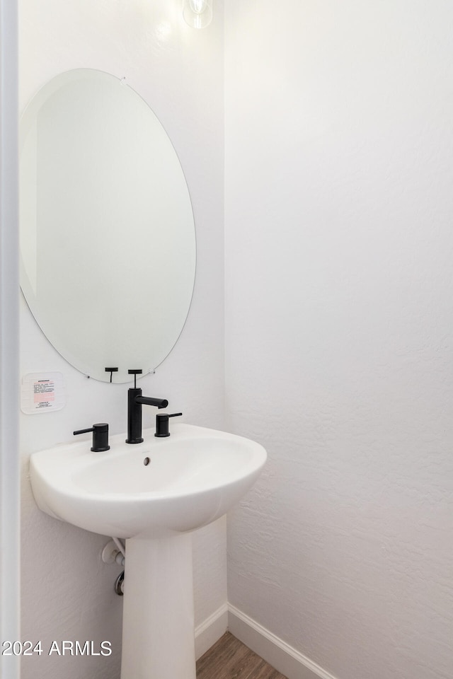 bathroom featuring hardwood / wood-style flooring and sink