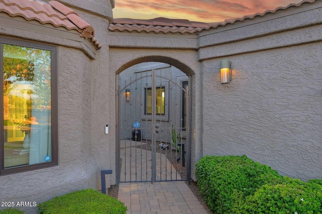 7596 N Via De La Siesta, Scottsdale, AZ 85258 - entrance to property with stucco siding, a gate, and a tiled roof