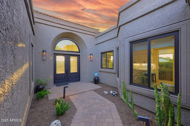 7596 N Via De La Siesta, Scottsdale, AZ 85258 - exterior entry at dusk featuring stucco siding