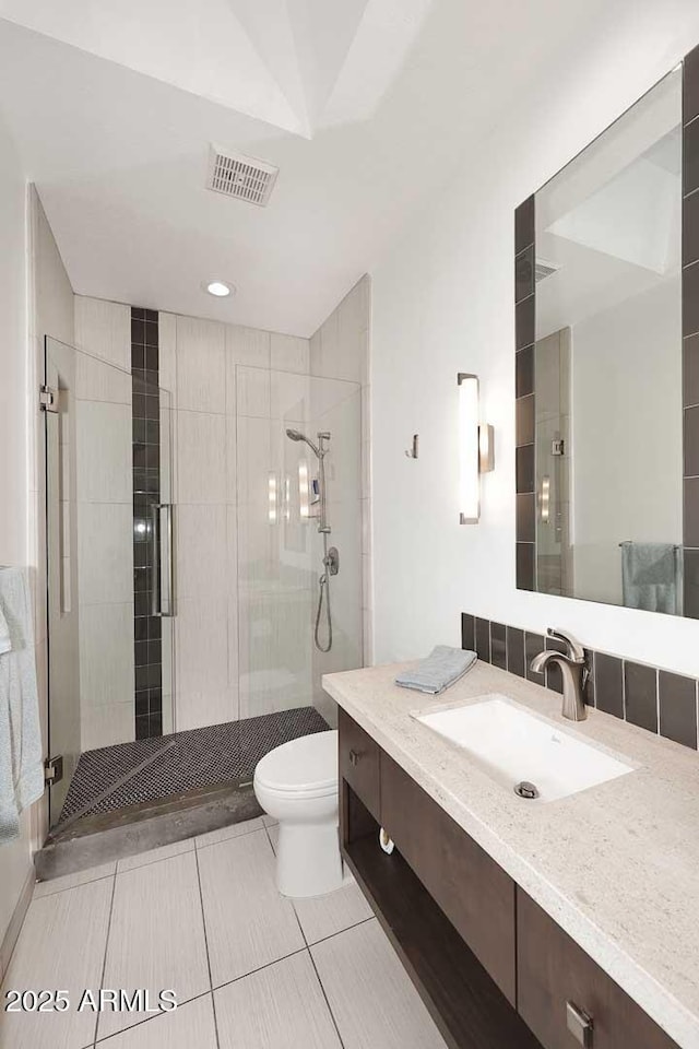 7596 N Via De La Siesta, Scottsdale, AZ 85258 - full bath featuring a shower stall, toilet, tile patterned floors, and vanity