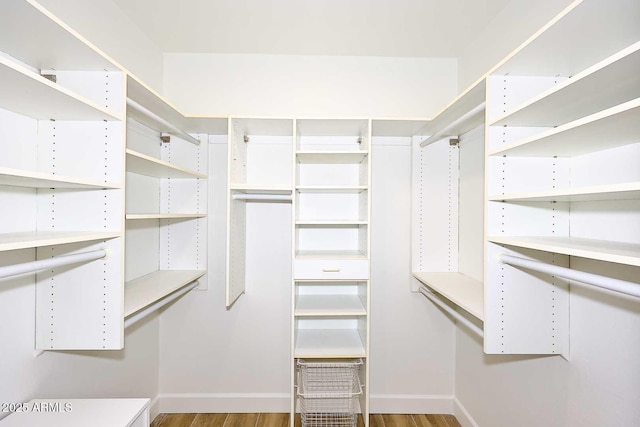 7596 N Via De La Siesta, Scottsdale, AZ 85258 - walk in closet featuring wood finished floors