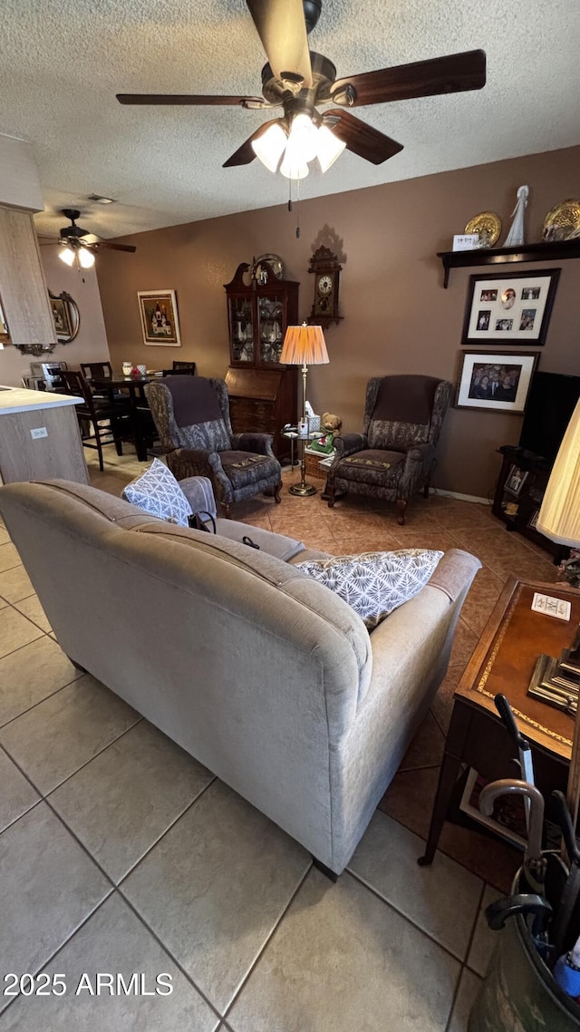 1440 N Idaho Rd Unit 1022, Apache Junction, AZ 85119 - living area featuring a ceiling fan, tile patterned flooring, and a textured ceiling