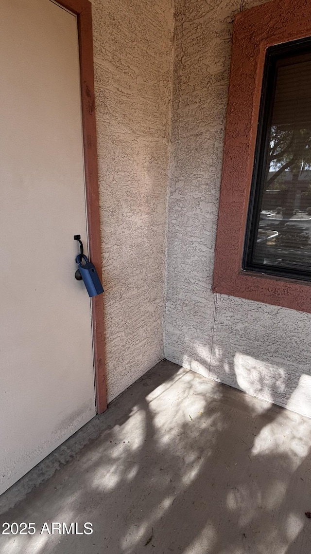 1440 N Idaho Rd Unit 1022, Apache Junction, AZ 85119 - spare room with unfinished concrete flooring