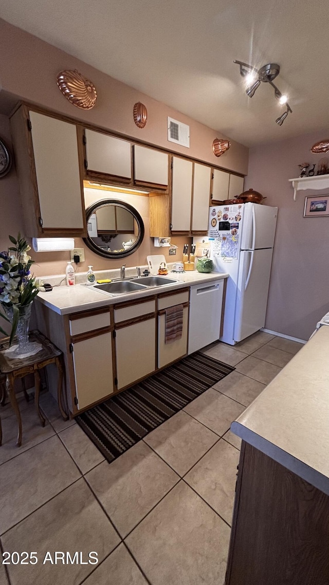 1440 N Idaho Rd Unit 1022, Apache Junction, AZ 85119 - kitchen with freestanding refrigerator, dishwasher, light tile patterned floors, and light countertops
