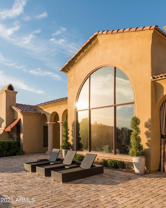 view of patio terrace at dusk