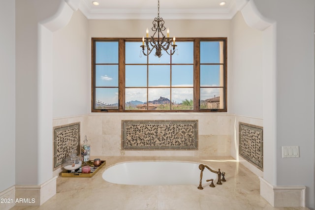 bathroom featuring a chandelier and ornamental molding