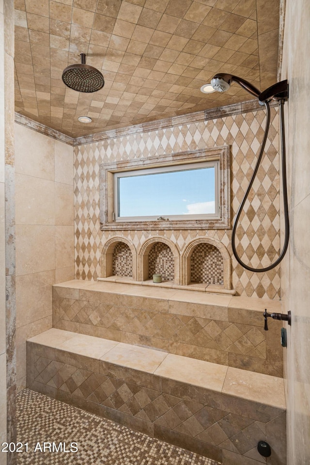 bathroom featuring a tile shower