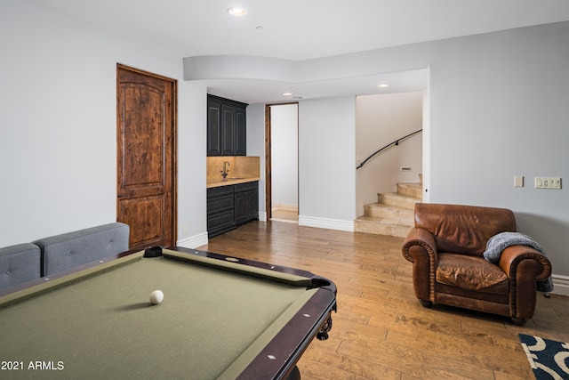 rec room with wet bar, hardwood / wood-style floors, and billiards