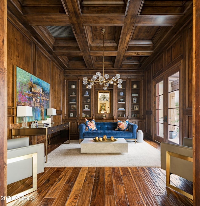 unfurnished room featuring wood ceiling, ornamental molding, wooden walls, and coffered ceiling