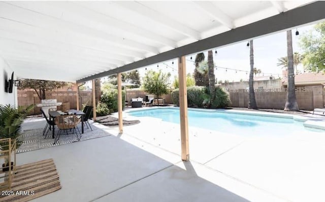 view of pool featuring a patio area