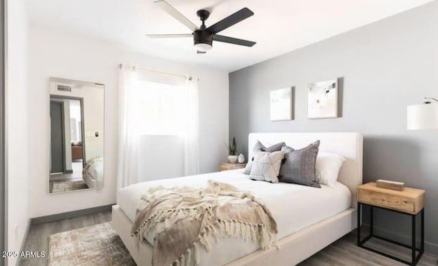 bedroom featuring hardwood / wood-style floors and ceiling fan