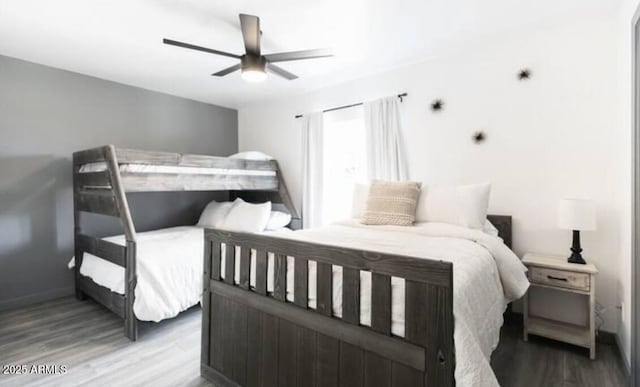 bedroom featuring ceiling fan and hardwood / wood-style floors