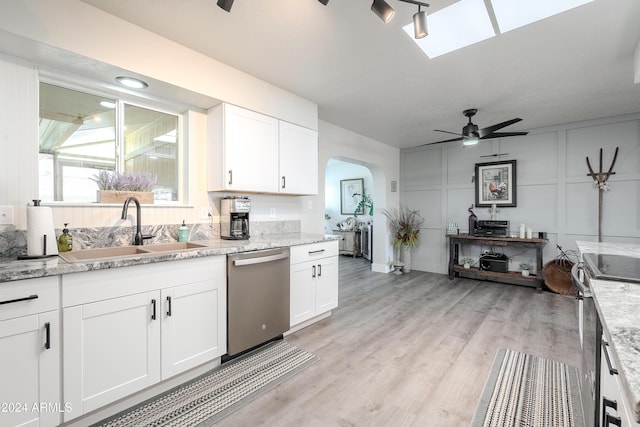 kitchen featuring ceiling fan, sink, white cabinets, and appliances with stainless steel finishes