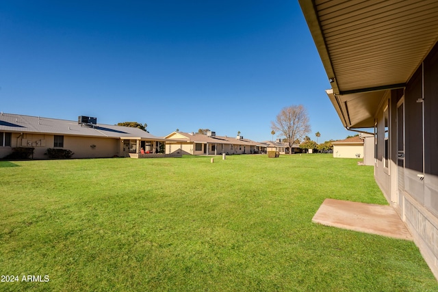 view of yard featuring central air condition unit