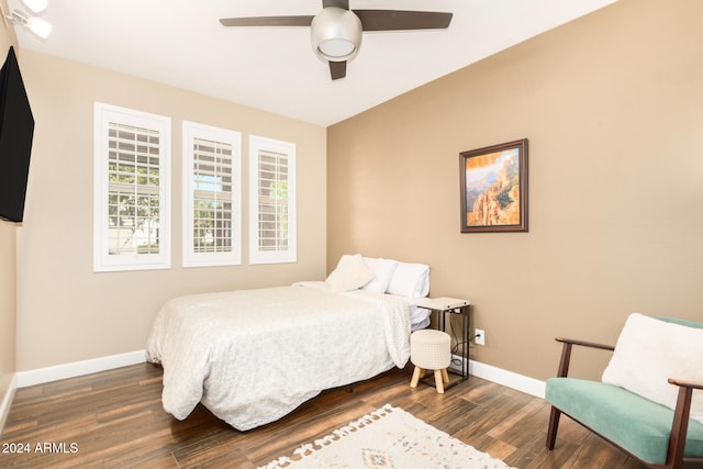 bedroom with ceiling fan and dark wood-type flooring