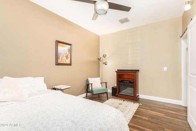 bedroom featuring ceiling fan and dark hardwood / wood-style flooring