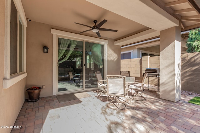 view of patio featuring ceiling fan