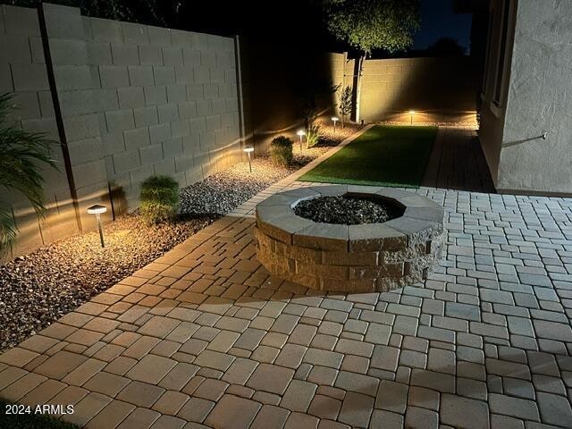 view of patio / terrace with a fire pit