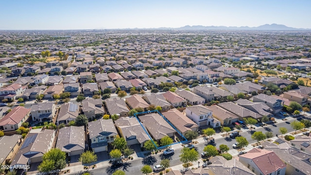 birds eye view of property with a mountain view