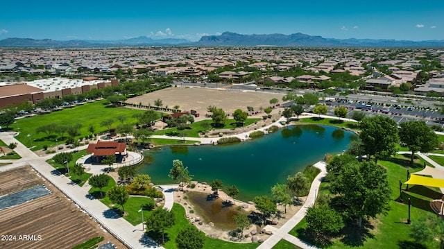 bird's eye view with a water and mountain view