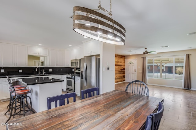 dining space with recessed lighting, visible vents, and a ceiling fan