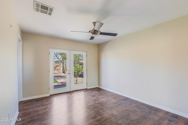 unfurnished room with visible vents, baseboards, french doors, wood finished floors, and a ceiling fan