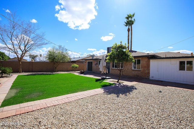 view of yard with a patio and fence