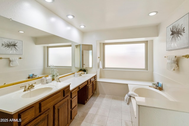 bathroom featuring tile patterned flooring, vanity, and a bathing tub