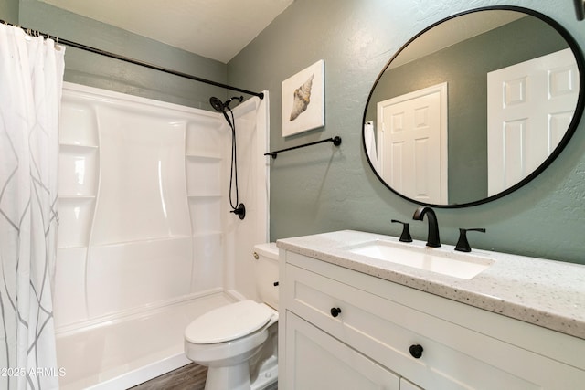 bathroom with hardwood / wood-style floors, vanity, curtained shower, and toilet