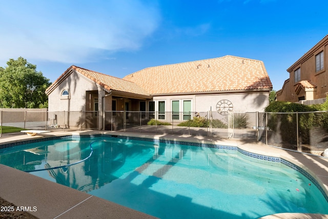 view of pool featuring a diving board