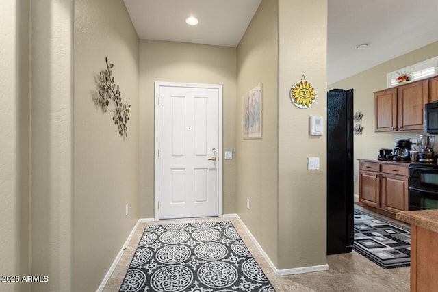 doorway with light tile patterned floors