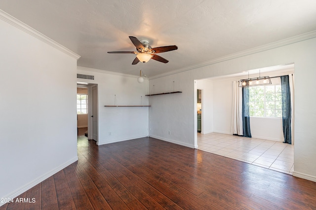 unfurnished room featuring ceiling fan, light hardwood / wood-style floors, and crown molding