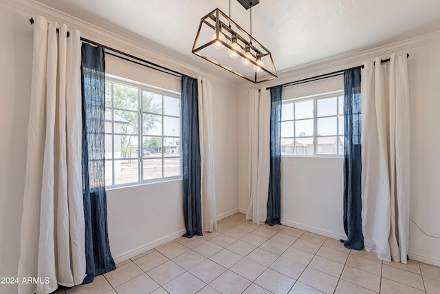 tiled empty room featuring ornamental molding