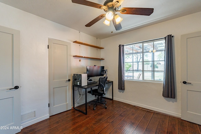 home office with dark hardwood / wood-style floors and ceiling fan