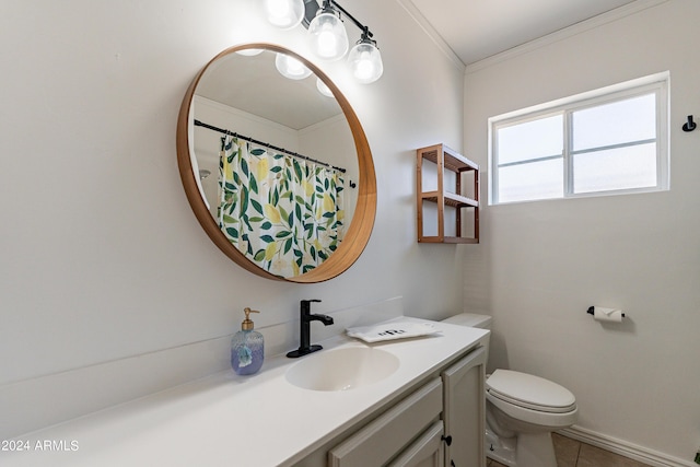 bathroom with tile patterned floors, vanity, toilet, and ornamental molding