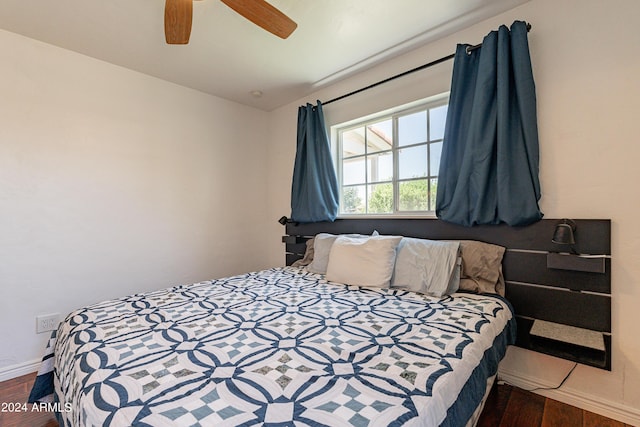 bedroom featuring ceiling fan and dark hardwood / wood-style flooring