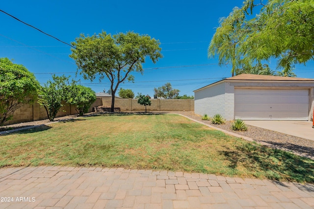 view of yard with an outbuilding and a garage