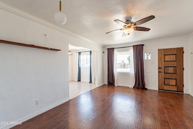 interior space featuring ceiling fan, dark hardwood / wood-style flooring, and ornamental molding