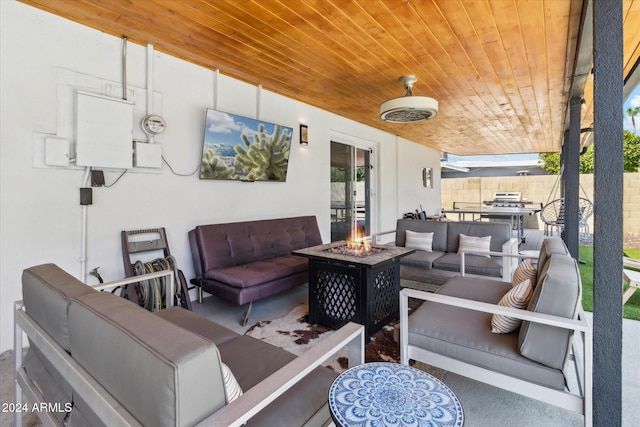 view of patio featuring an outdoor living space with a fire pit