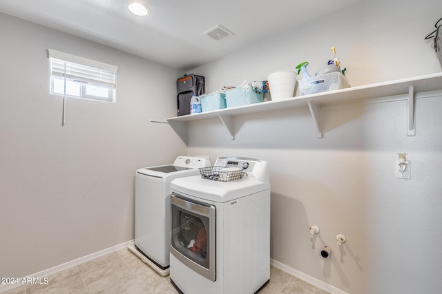 laundry area with independent washer and dryer