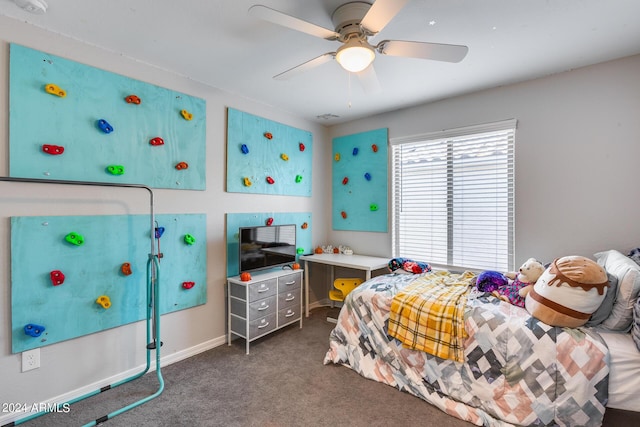 bedroom with ceiling fan and dark carpet