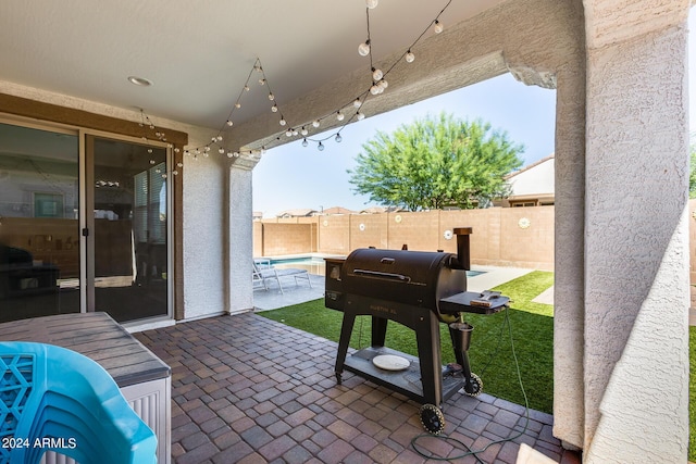 view of patio featuring a grill